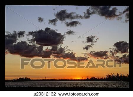 Sunset over a lake View Large Photo Image Stock Image - Sunset over a lake. Fotosearch