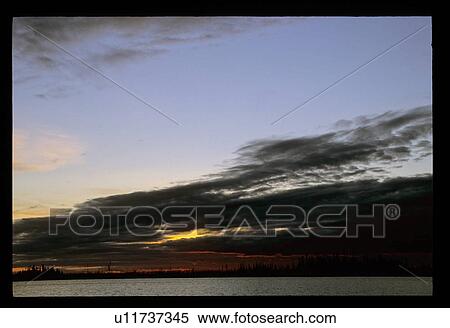 Stock Photography - Sunset over a lake. Fotosearch