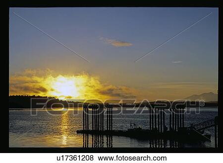 Sunset over the water View Large Photo Image Stock Photo - Sunset over the water. Fotosearch