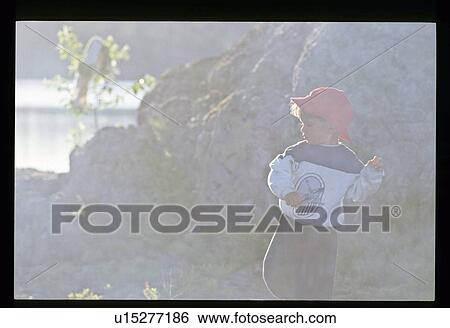 Throwing rocks View Large Photo Image Stock Photograph - Throwing rocks . Fotosearch