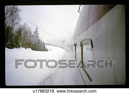 Stock Photo - Train on a snowy track. Fotosearch