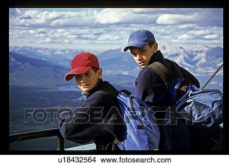 Two boys looking at mountains View Large Photo Image Picture - Two boys looking at mountains. Fotosearch