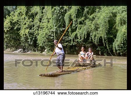 Two women transported on bamboo raft View Large Photo Image Picture - Two women transported on bamboo raft. Fotosearch