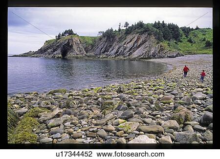 Walking on rocky shore View Large Photo Image Stock Image - Walking on rocky shore. Fotosearch