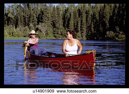 Woman canoeing View Large Photo Image Stock Photo - Woman canoeing . Fotosearch
