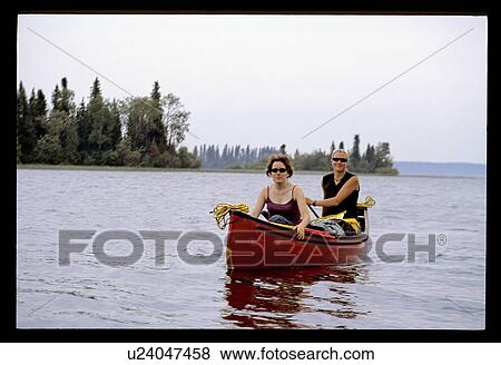 Stock Photo - Woman canoeing. Fotosearch