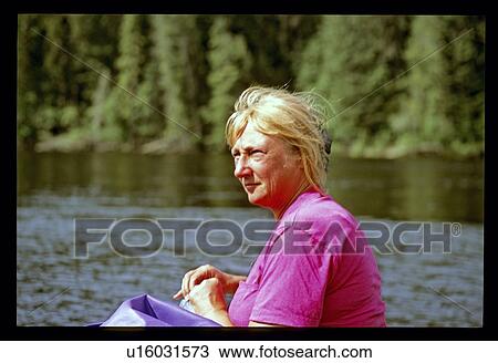 Stock Image - Woman in the lake. Fotosearch