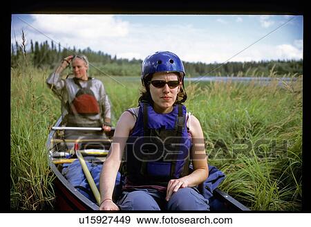 Stock Photo - Women canoeing . Fotosearch