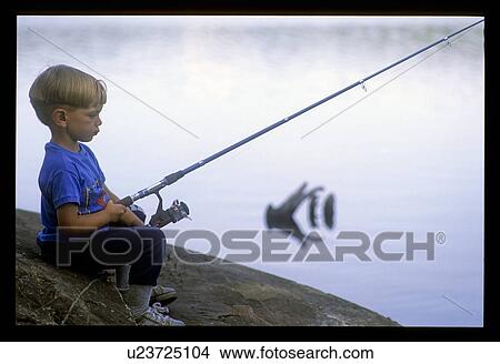 Young boy fishing View Large Photo Image Picture - Young boy fishing. Fotosearch