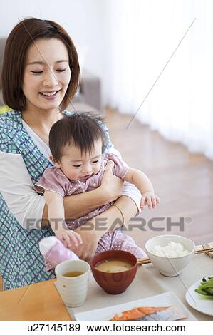 Baby Being Fed View Large Photo Image Stock Photo - Baby Being Fed. Fotosearch
