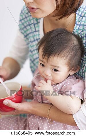 Baby Being Fed View Large Photo Image Stock Photography - Baby Being Fed. Fotosearch
