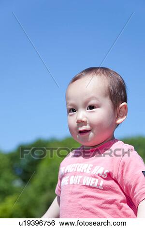Baby Boy Against Blue Sky View Large Photo Image Stock Photograph - Baby Boy Against Blue Sky. Fotosearch