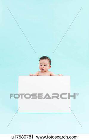 Stock Image - Baby Boy Holding Blank Message. Fotosearch