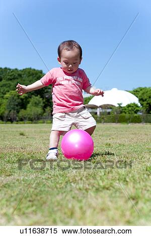Stock Photography - Baby Boy Playing With Ball. Fotosearch