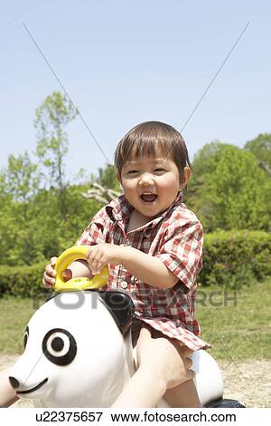 Baby Boy Riding on Toy Panda View Large Photo Image Stock Photo - Baby Boy Riding on Toy Panda. Fotosearch