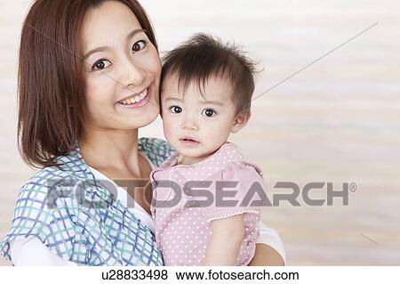 Stock Photo - Baby Girl and Mother. Fotosearch