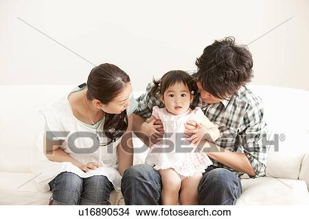 Picture - Baby Girl and Parents. Fotosearch