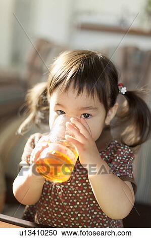 Baby Girl Drinking Juice View Large Photo Image Stock Image - Baby Girl Drinking Juice. Fotosearch