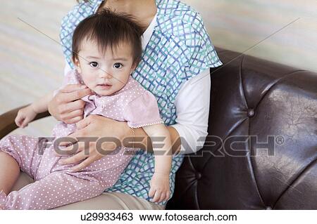 Baby Girl on Mother's Lap View Large Photo Image Stock Image - Baby Girl on Mother's Lap. Fotosearch