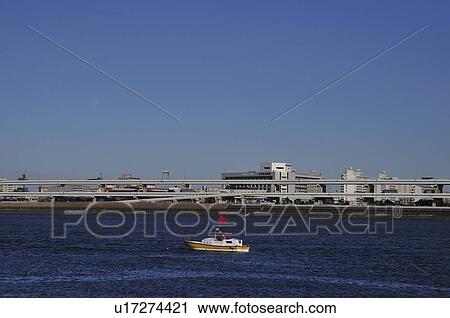 Stock Image - Boat on Arakawa river, Koto ward, Tokyo Prefecture, Honshu, Japan. Fotosearch