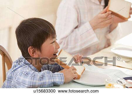 Boy at Breakfast Table View Large Photo Image Stock Image - Boy at Breakfast Table. Fotosearch