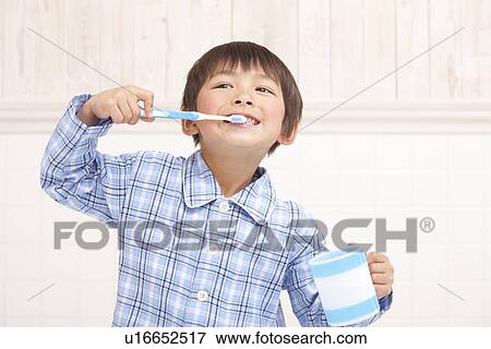 Stock Photo - Boy Brushing Teeth. Fotosearch