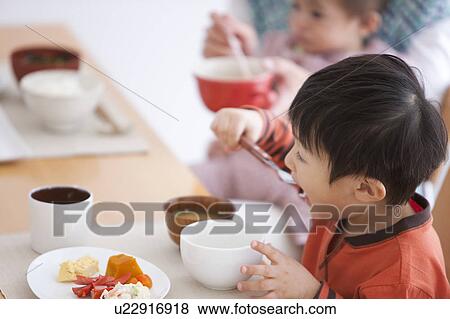 Stock Photo - Boy Having Breakfast. Fotosearch