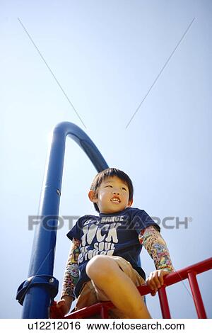 Boy in Playground View Large Photo Image Stock Photograph - Boy in Playground. Fotosearch