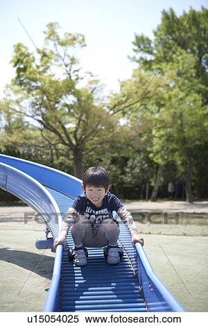 Boy on Slide View Large Photo Image Stock Photography - Boy on Slide. Fotosearch