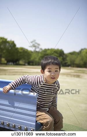 Boy Playing on Slide View Large Photo Image Stock Photo - Boy Playing on Slide. Fotosearch