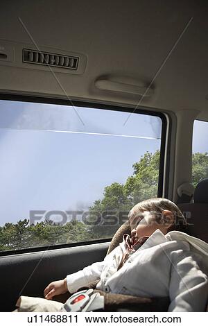 Stock Image - Boy Sleeping in Car. Fotosearch