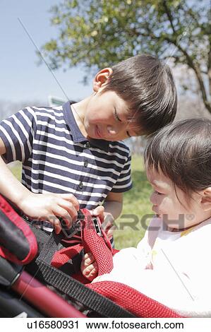 Brother Helping Little Sister with Buggy View Large Photo Image Stock Image - Brother Helping Little Sister with Buggy. Fotosearch