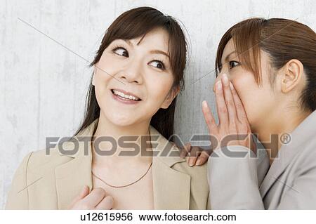 Buisnesswoman Whispering to Colleague View Large Photo Image Stock Photograph - Buisnesswoman Whispering to Colleague. Fotosearch