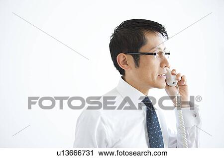 Stock Image - Businessman on Phone. Fotosearch