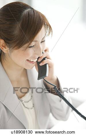 Stock Image - Businesswoman on Phone. Fotosearch