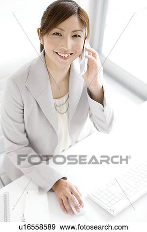 Stock Photo - Businesswoman On Phone. Fotosearch