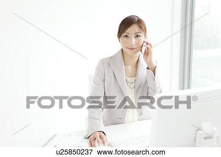 Stock Photo - Businesswoman On Phone. Fotosearch
