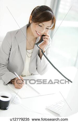 Stock Photography - Businesswoman on Phone. Fotosearch