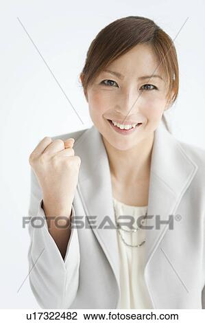 Stock Image - Businesswoman with Clenched Fist. Fotosearch