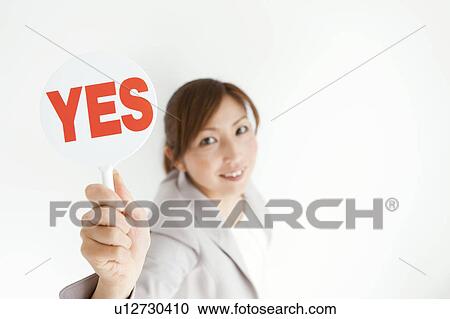 Stock Image - Businesswoman with Yes Sign. Fotosearch