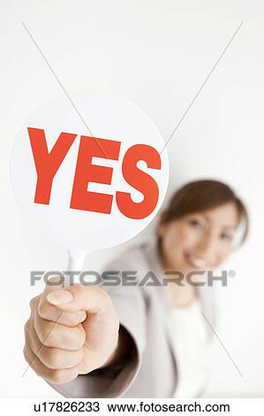 Stock Image - Businesswoman with Yes Sign. Fotosearch