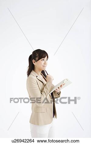 Businesswoman Writing in Diary View Large Photo Image Picture - Businesswoman Writing in Diary. Fotosearch