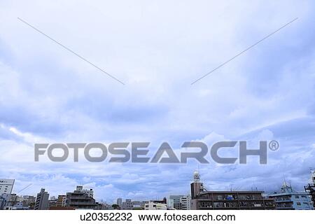 Stock Image - Clouds Over City. Fotosearch