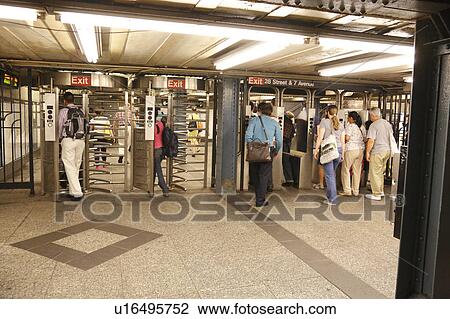 Stock Image - Commuters Entering Subway Station. Fotosearch