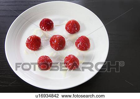 Condensed milk on strawberries View Large Photo Image Stock Image - Condensed milk on strawberries. Fotosearch