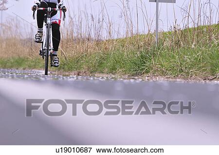 Cyclist on Road View Large Photo Image Stock Photo - Cyclist on Road. Fotosearch