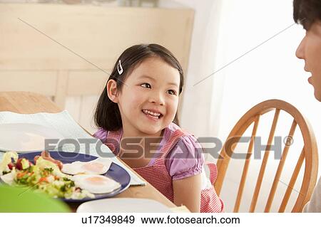 Daughter Talking to Father at Breakfast Table View Large Photo Image Stock Photo - Daughter Talking to Father at Breakfast Table. Fotosearch