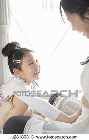 Daughter Touching Pregnant Mother's Stomach View Large Photo Image Stock Image - Daughter Touching Pregnant Mother's Stomach. Fotosearch