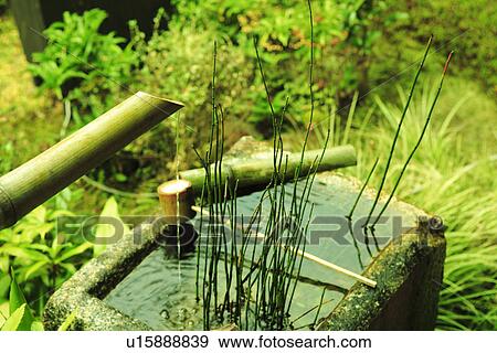Stock Photo - Deer Scarer in Japanese Garden. Fotosearch