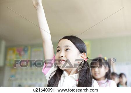 Elementary Schoolgirl Raising Hand in Classroom View Large Photo Image Stock Image - Elementary Schoolgirl Raising Hand in Classroom. Fotosearch